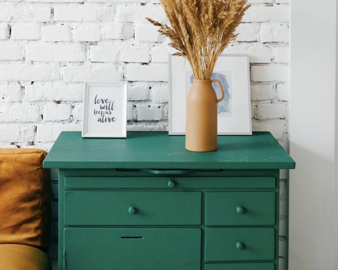 green dresser with flowers